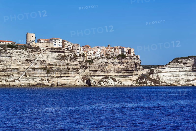 Upper town with the staircase of the King of Aragon on white chalk cliffs