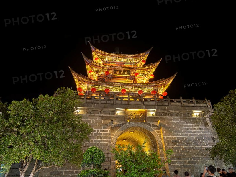 Old Chinese city gate with illuminated roofs