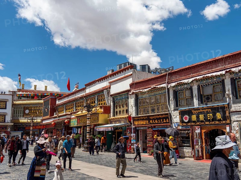 Pilgrims walk through the streets of Lhasa