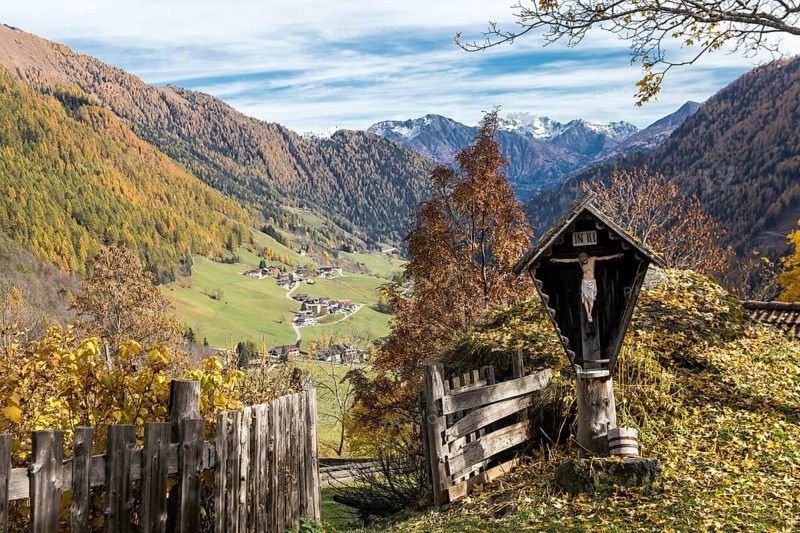 Cross in front of hut fence