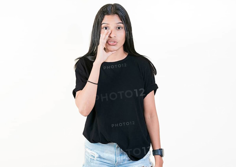 Girl whispering to the camera