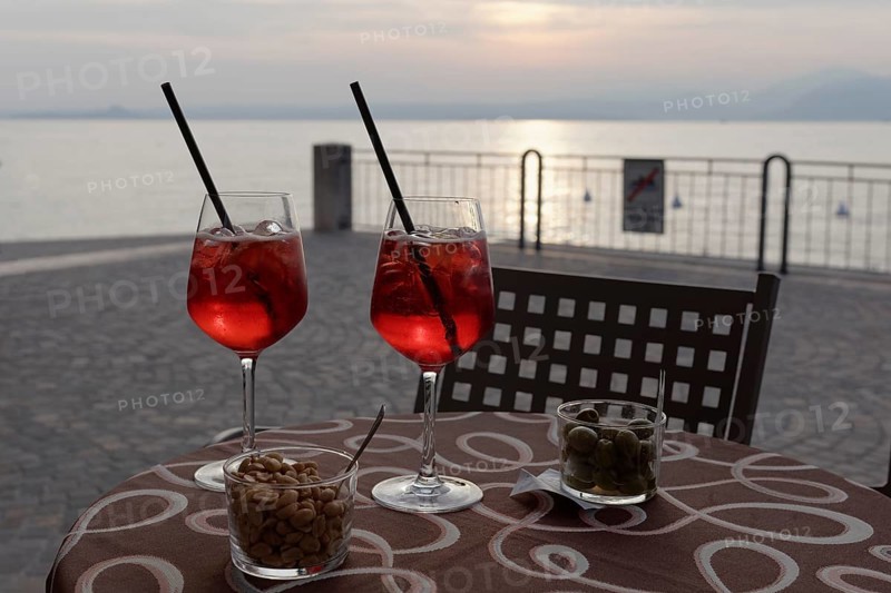 Two sundowners Campari Sprizz on a table on the waterfront