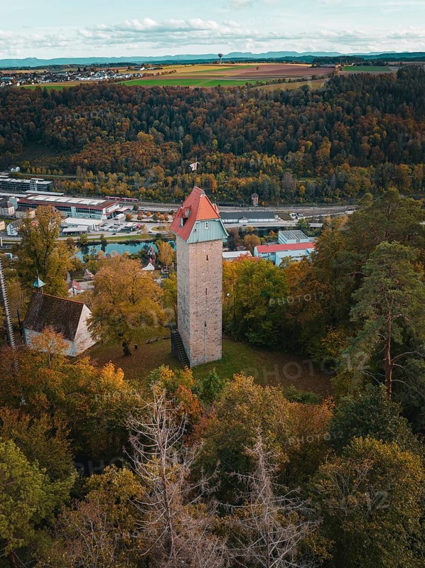 Historic tower in the autumn forest