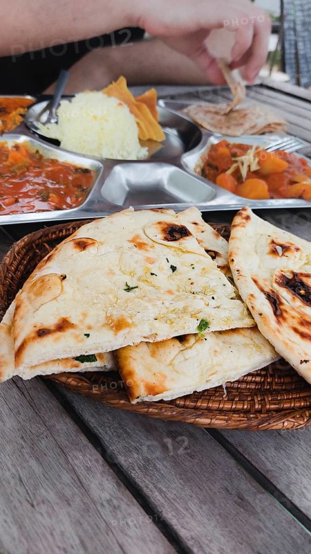 Tourist foodie eating vegetable curry or tarkari