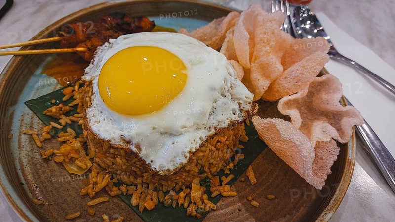 Malaysian fried rice or nasi goreng with chicken satay