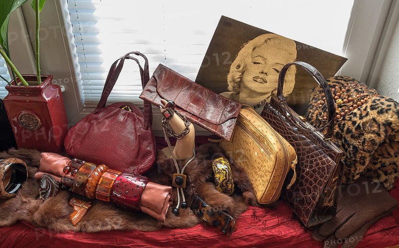 Bakelite jewellery and handbags decorated in front of a window