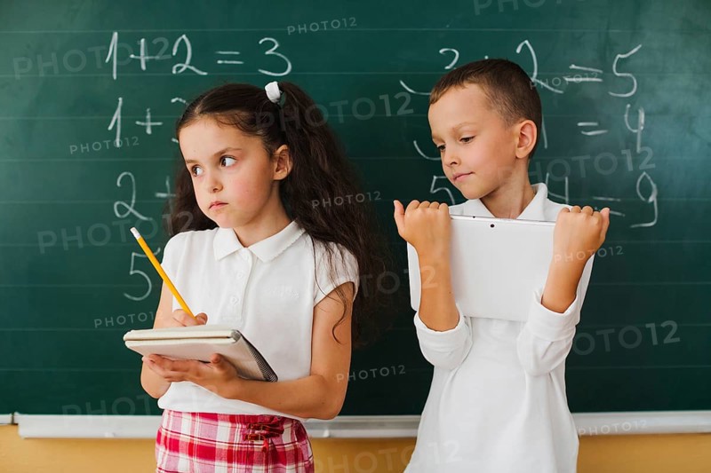 Classmates blackboard math lesson