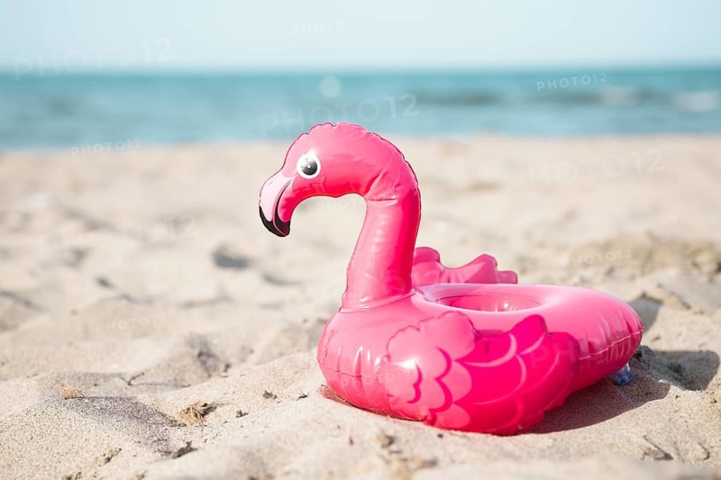 Close up inflatble flamingo swim ring beach
