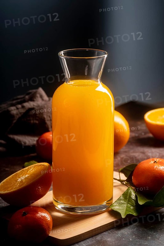Delicious orange juice bottle arrangement