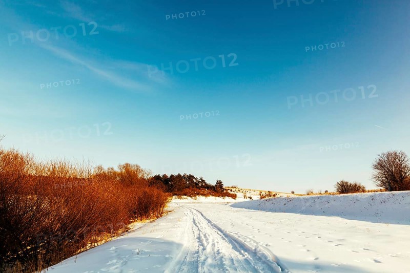 Diminishing perspective ski track snowy landscape against blue sky