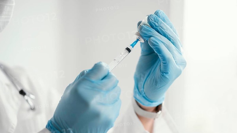 Doctor getting ready vaccine patient