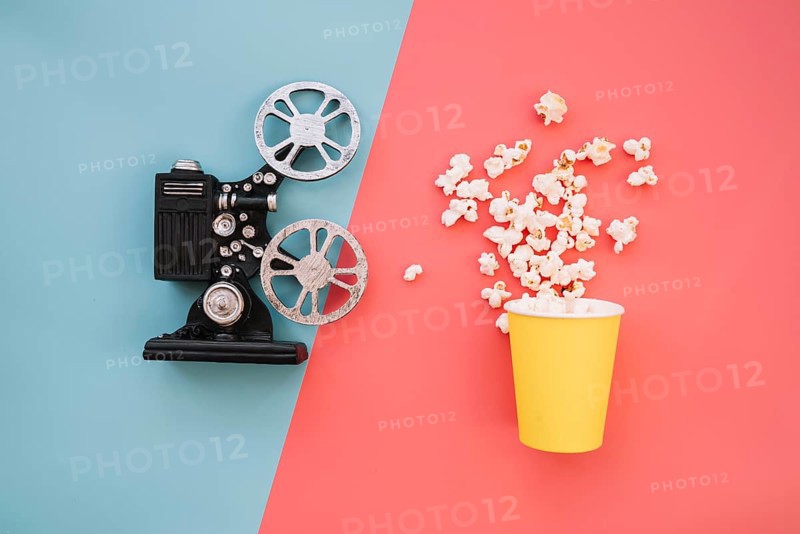 Film projector with popcorn box