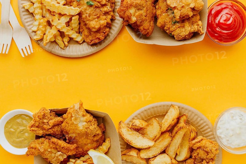 Flat lay fish chips with copy space sauces