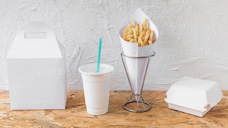 French fries disposal cup packages wooden desk