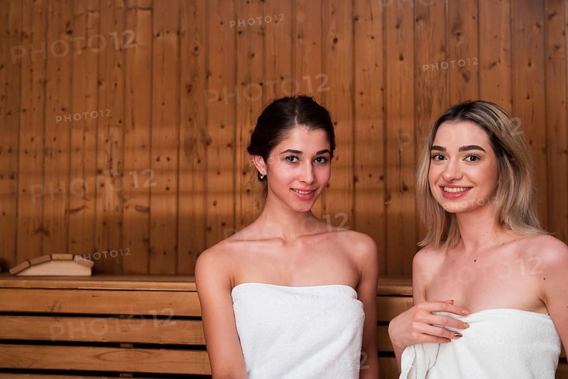 Friends posing relaxed sauna