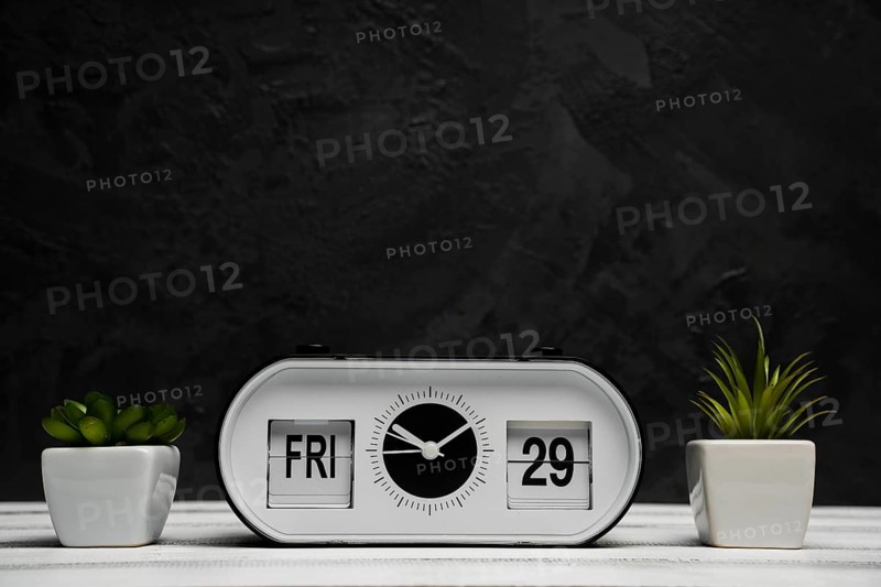 Front view clock bulbs with wooden table