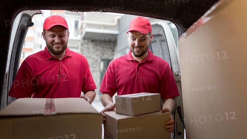 Front view delivery man with packagaes