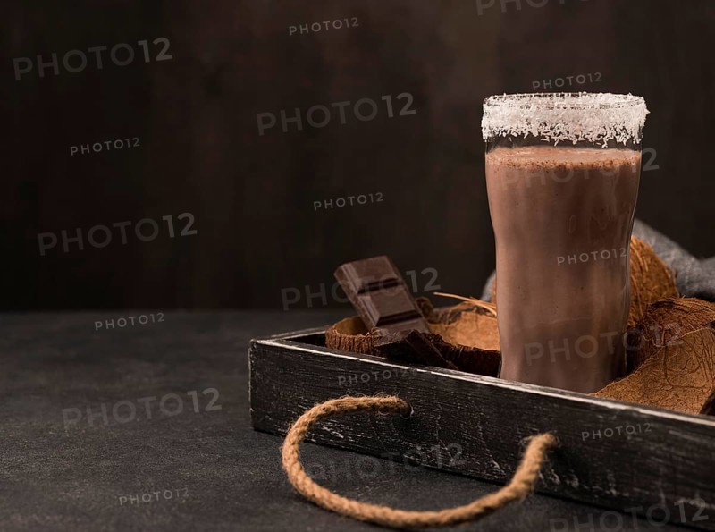 Front view milkshake glass tray with chocolate copy space