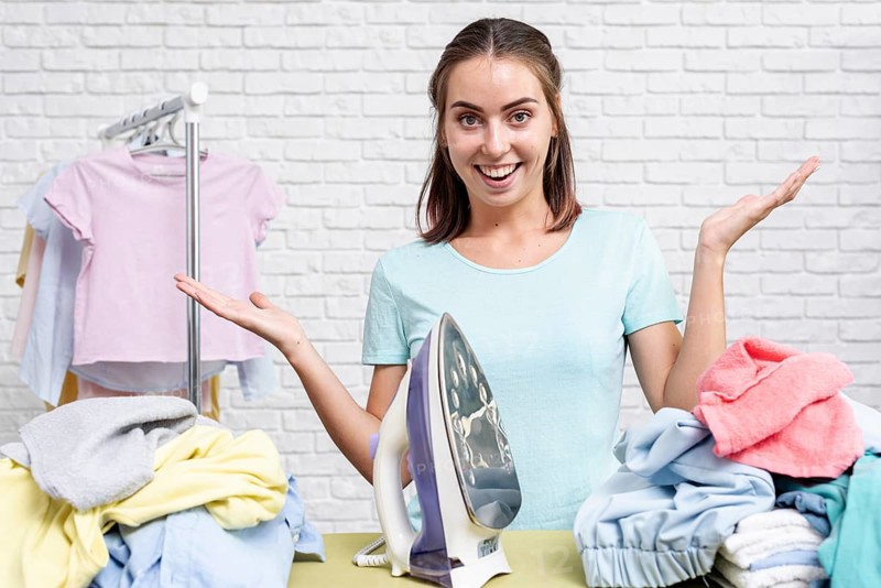 Front view woman ready ironing clothes