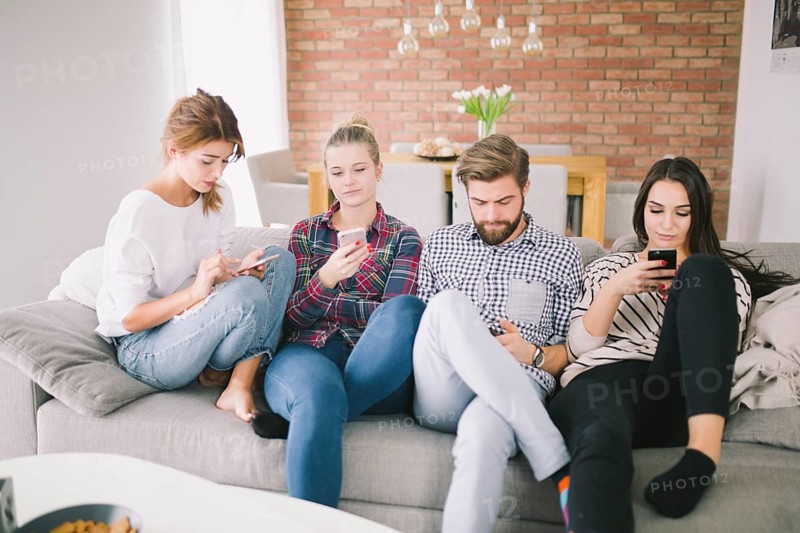 Group people using gadgets sofa