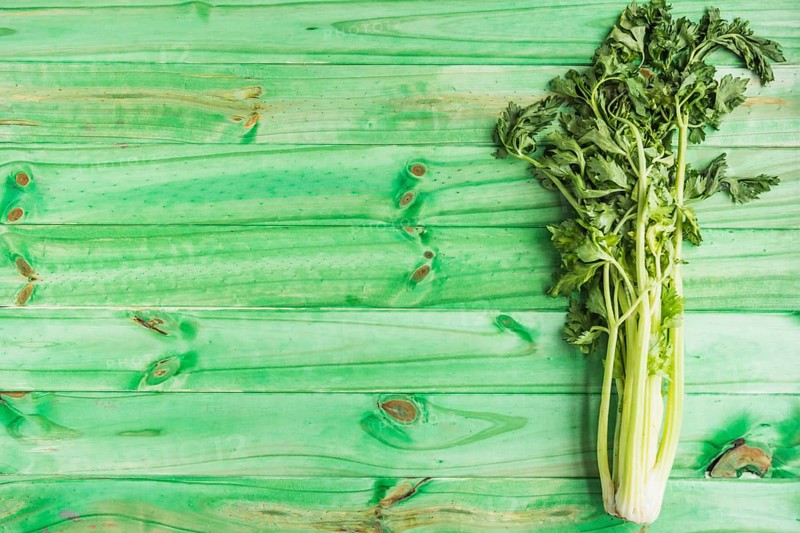 High angle view fresh celery green wooden background