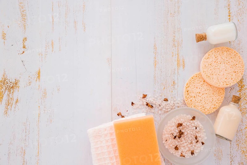 House cleaning tools near pink salt wooden table