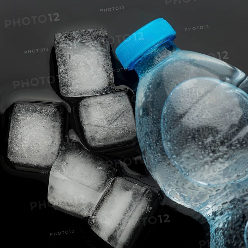 Ice cubes bottle water top view