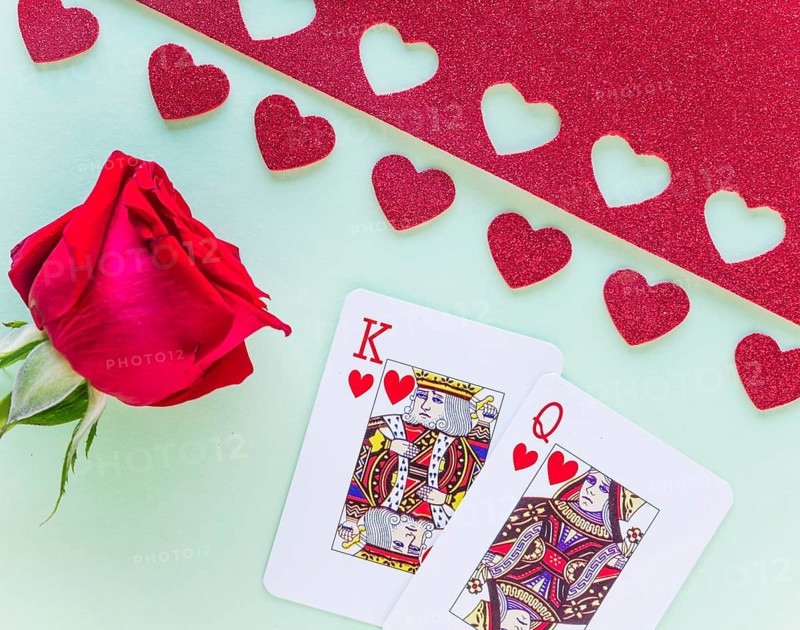 King queen hearts playing cards with rose