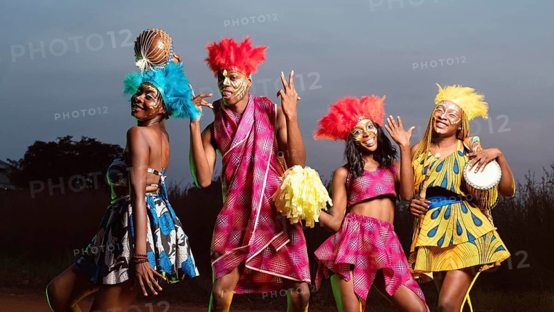 Low angle group friends dressed carnival