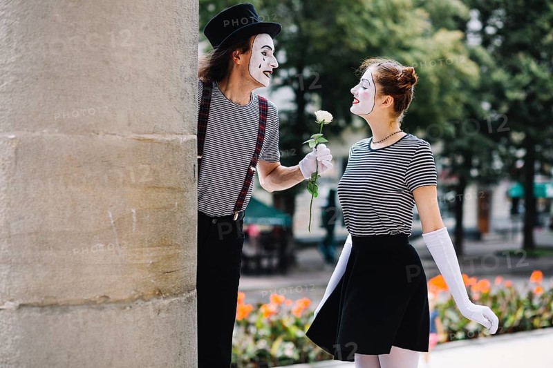 Male mime giving flower female mime