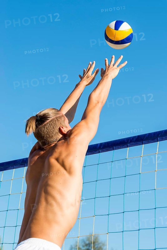 Man preparing hit incoming volleyball net