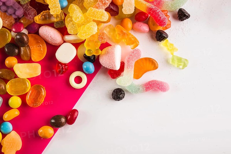 Multicolored winegums white fuchsia background