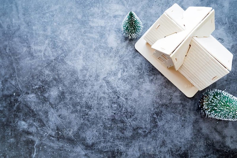 Overhead view house model with christmas tree weathered concrete background