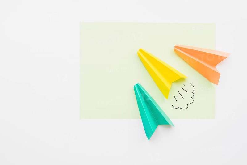 Paper planes flying diagonally