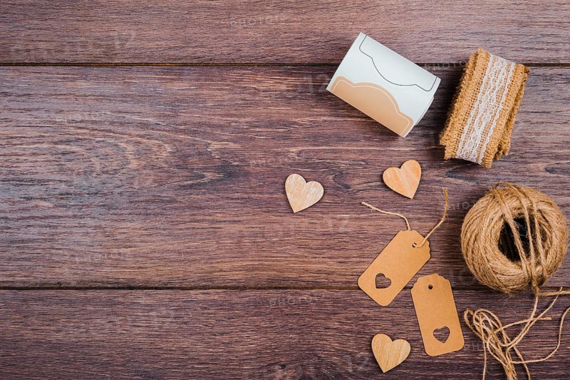 Rolled up lace wooden heart shape tags jute spool wooden desk