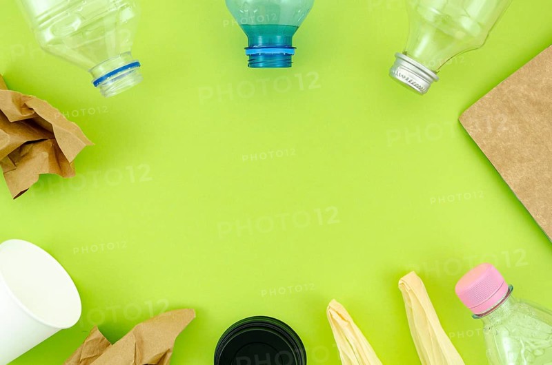 Top view colorful tableware green background