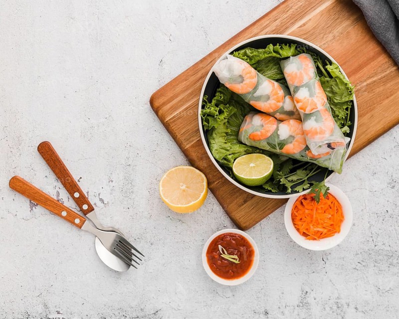 Top view fresh shrimp rolls bowl with sauce