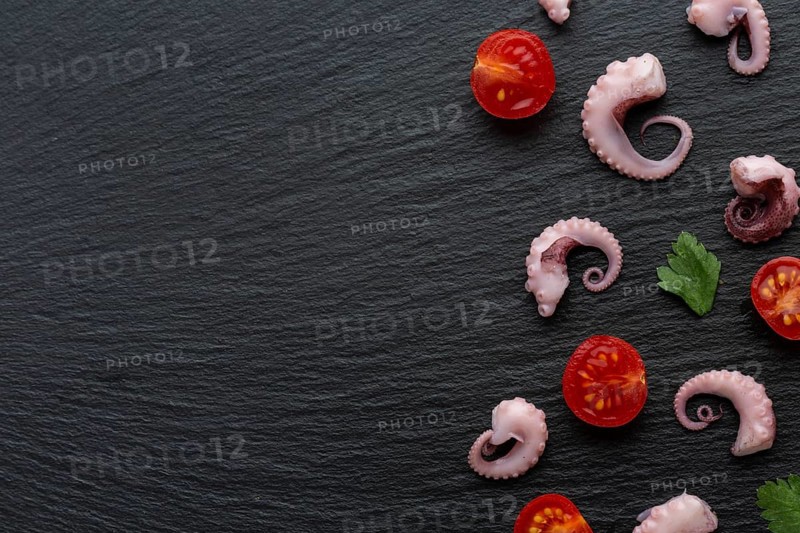Top view octopus pieces with vegetables