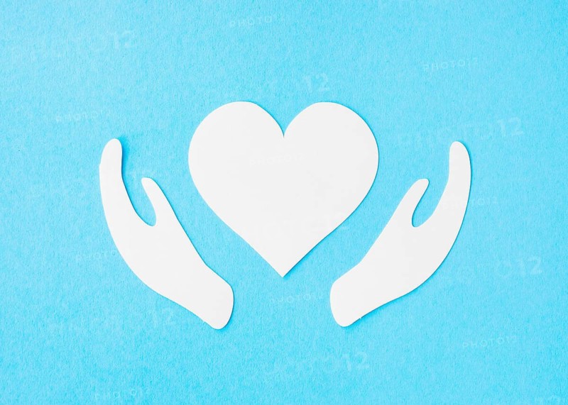 Top view paper heart with paper hands