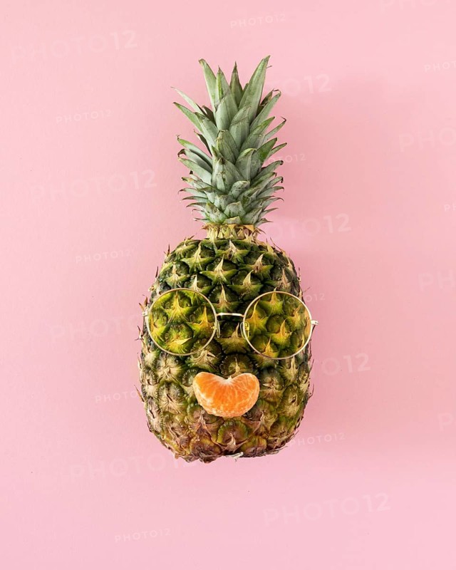 Top view pineapple with sunglasses