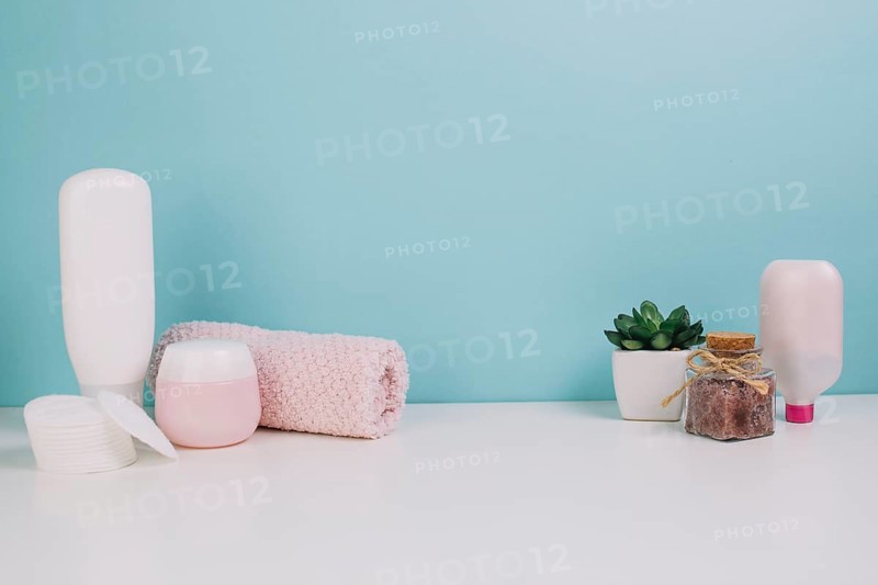 Towel cotton pads near cosmetics bottles