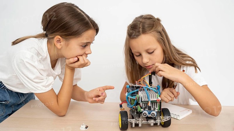 Two girls doing science experiments together