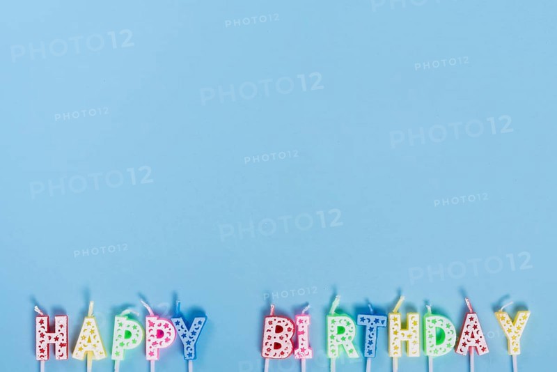 Unlit birthday candles with letters