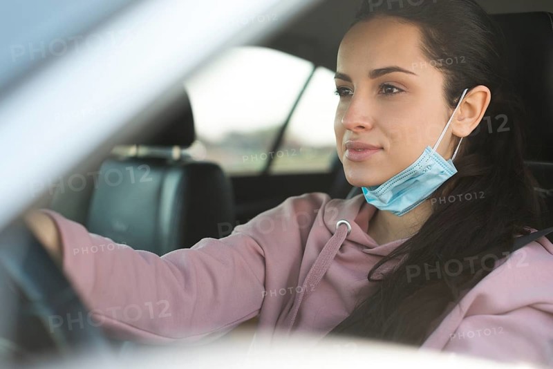 Woman car use properly mask