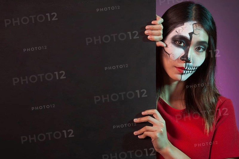Woman wearing halloween costume wall