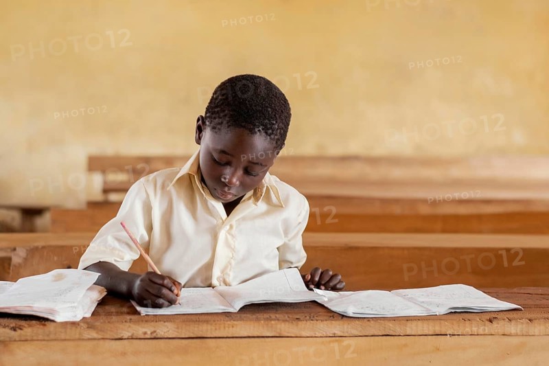 African kid learning class 3