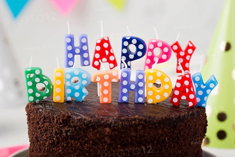 Assortment with birthday chocolate cake candles