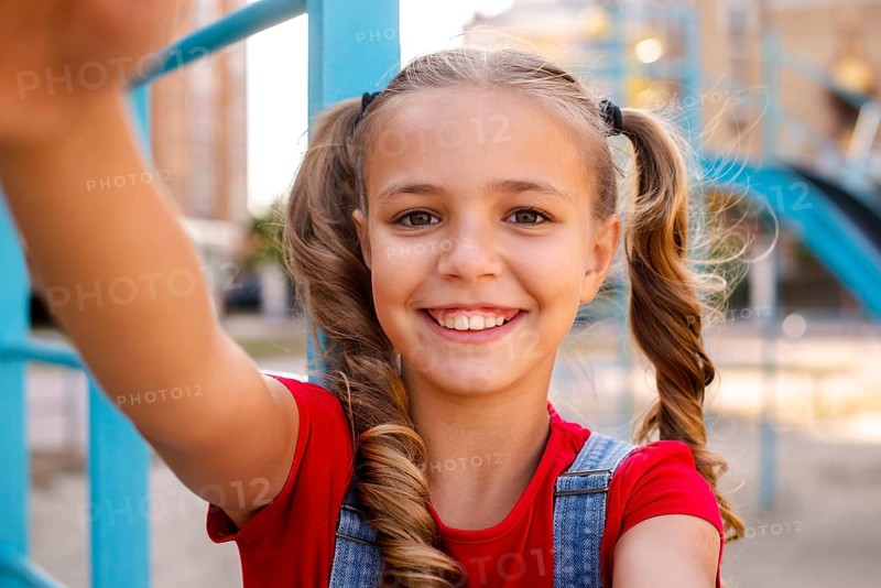 Blonde girl stretching out her hands camera
