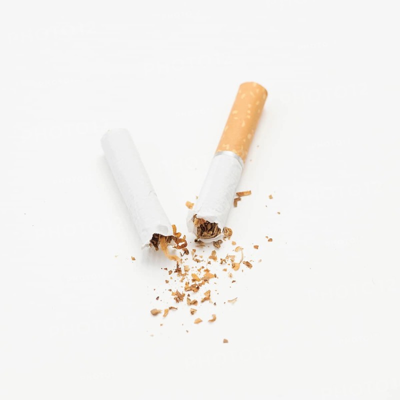 Broken cigarette tobacco isolated white background