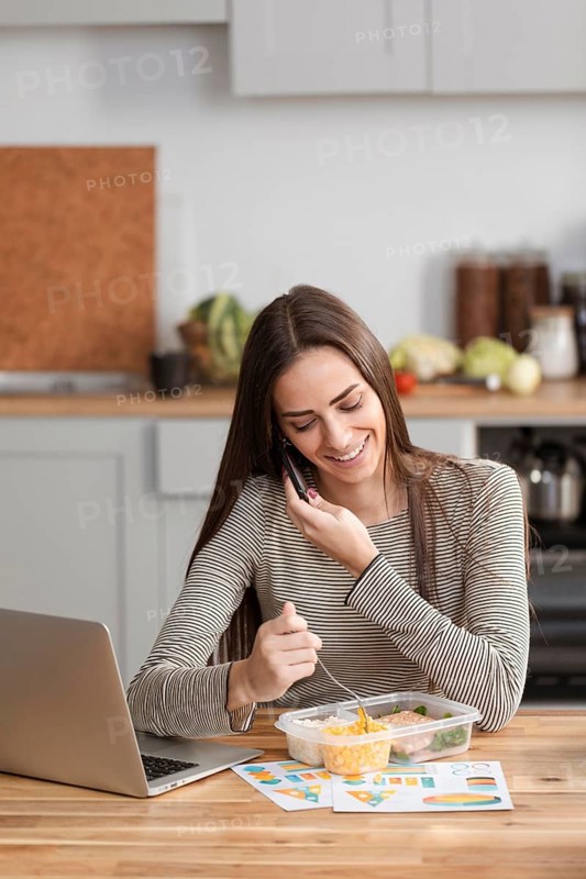 Businesswoman trying eat work